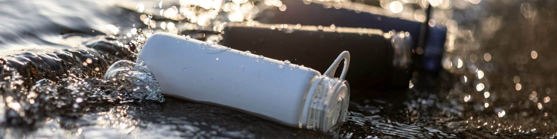white disposable cup on water